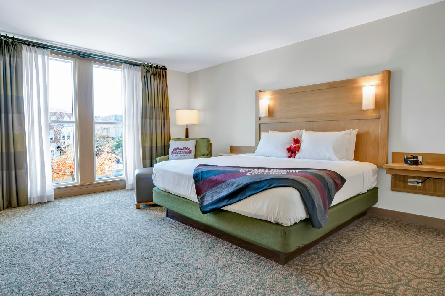 Guest room with a Swarthmore College blanket on the bed